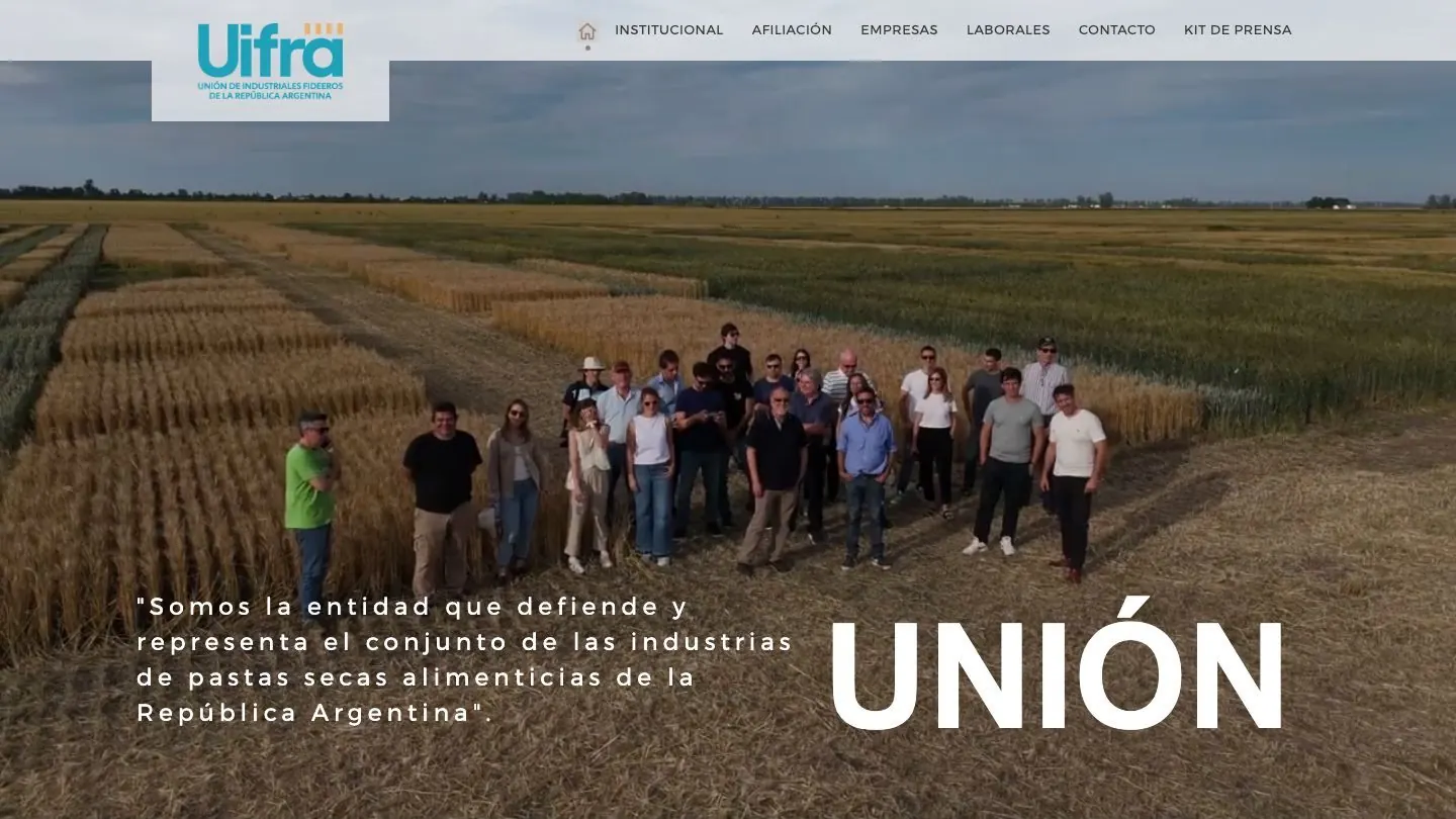 Portada de uifra.org.ar, con un campo de trigo y la frase de la entidad